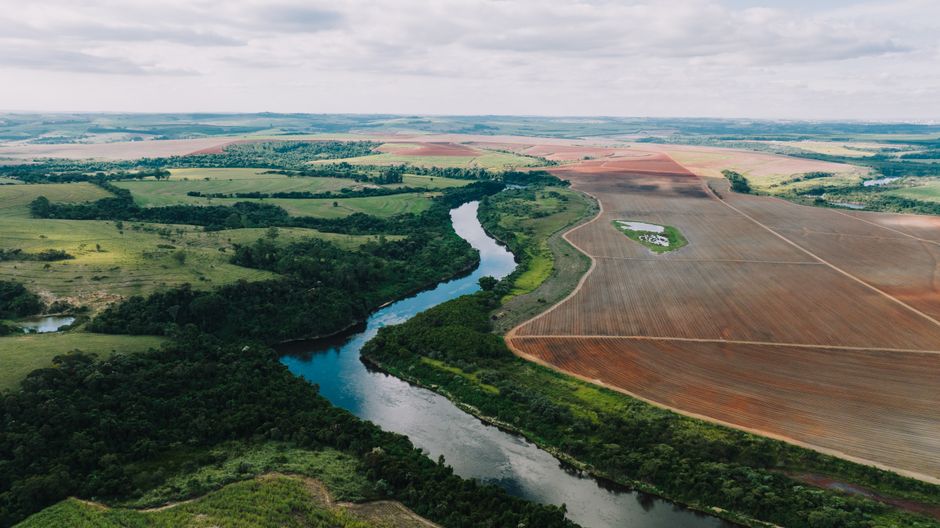 Stunning aerial view of the lush landscape and river in Porto Feliz, Brazil.