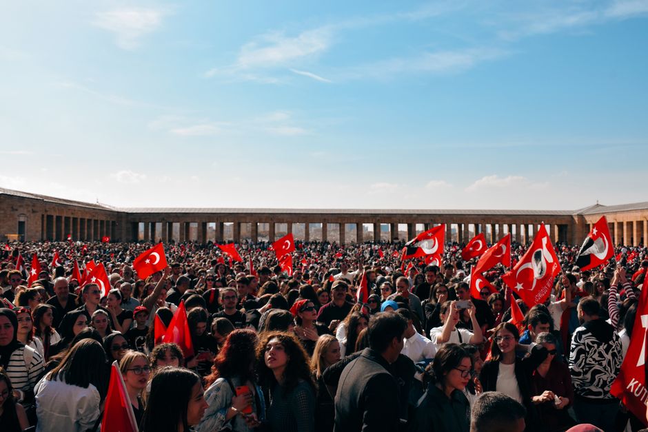 Massive gathering at Anıtkabir, Ankara, featuring people with Turkish flags during a national celebration.