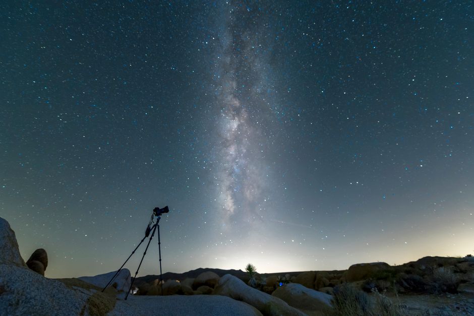 A breathtaking view of the Milky Way captured over rocks in a California desert.