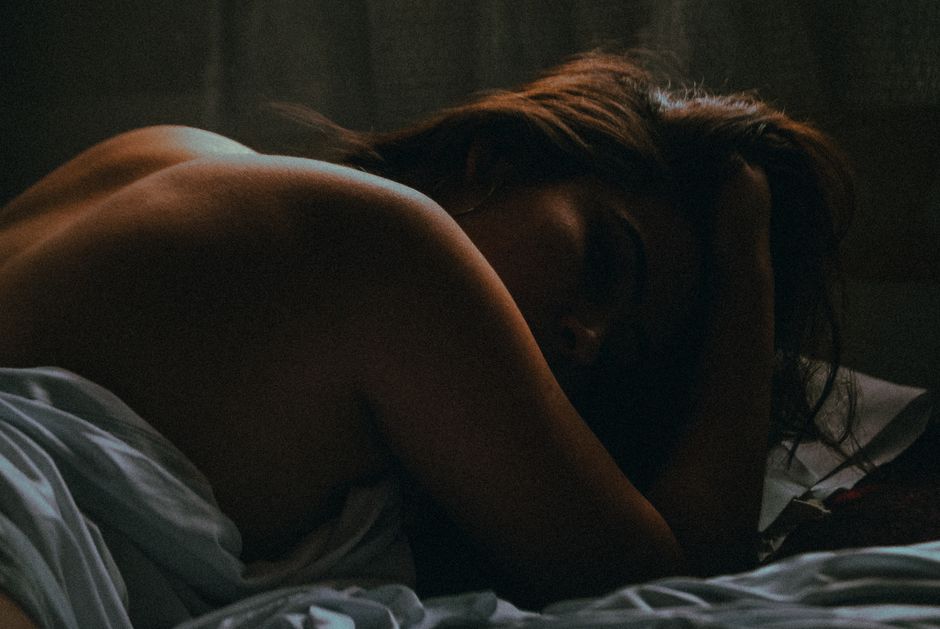 A contemplative mood captures a resting woman's serene and introspective moment.