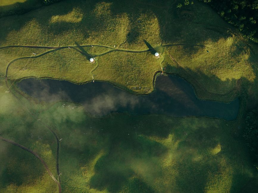 Discover the lush green terrain and serene water bodies from above, a true Brazilian beauty.