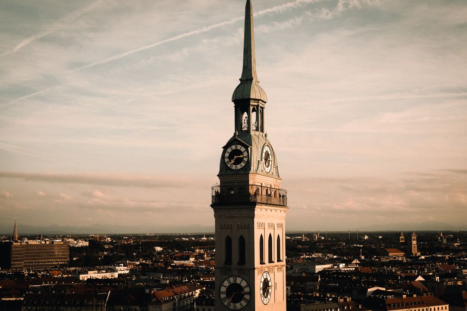 Stunning aerial view of a historic clock tower amidst an urban skyline at twilight.
