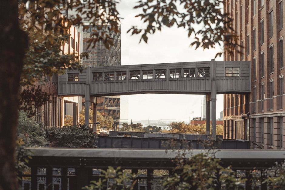 Modern architecture with a bridge over the High Line in New York City highlighting urban design.
