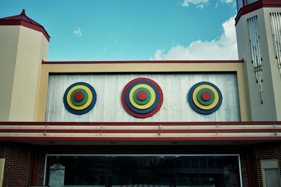 Colorful Art Deco building facade with geometric designs at Glen Echo Park, Maryland.