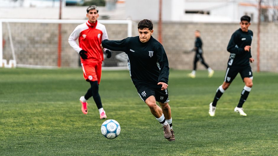 Intense soccer training session with young athletes showcasing skills on the field.
