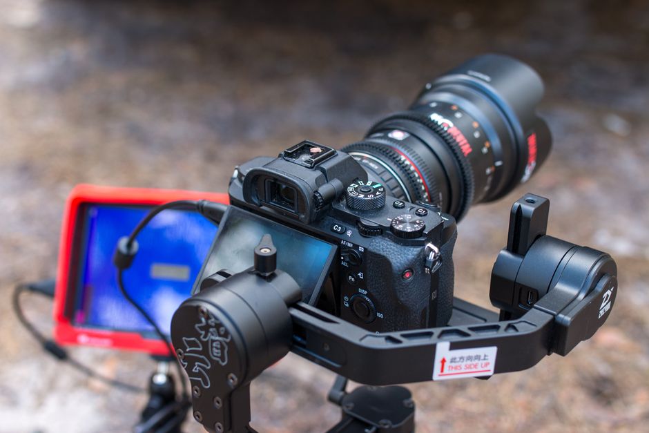 Professional camera setup with lens and stabilizer for videography and photography.
