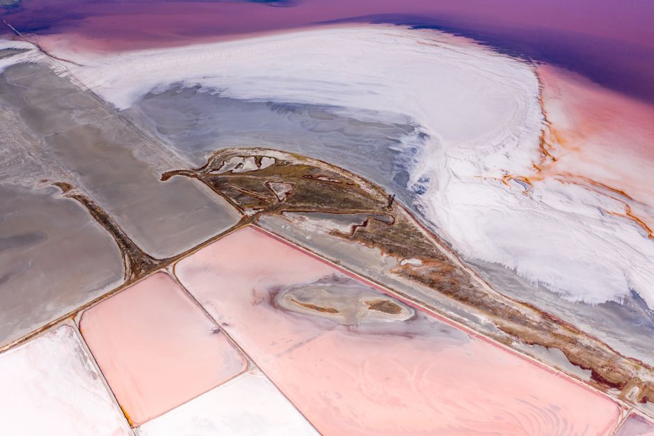 Stunning aerial photograph of colorful salt ponds showcasing vivid patterns in nature.